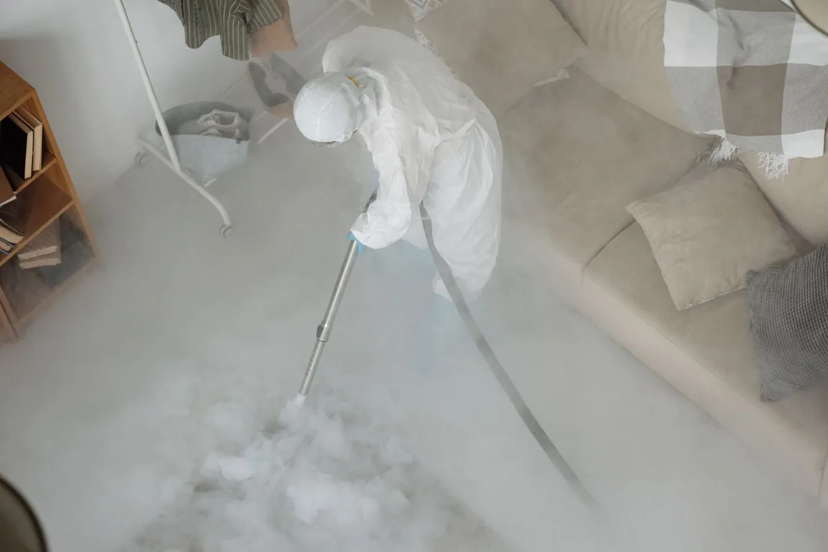 Biohazard cleanup technician in protective equipment, Marfa, TX